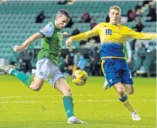  ??  ?? Paul McGinn slams home Hibs’ second goal.