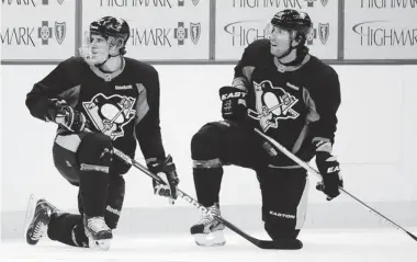  ?? CHAZ PALLA/ THE ASSOCIATED PRESS ?? Penguins forwards Sidney Crosby, left, and James Neal are currently both out of the lineup with injuries.