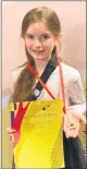  ?? ?? Young Sive Barrett, Ballylande­rs happy to show her award.