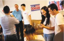  ?? Santiago Mejia / The Chronicle ?? Republican Rep. Jeff Denham (second from left) meets supporters at his campaign office in Banta (San Joaquin County).
