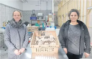  ??  ?? Lysiane Roy Maheu, left, and Dominique Lynch-Gauthier, co-founder of Montreal urban mushroom farming startup Blanc de Gris pose in the warehouse of the company.