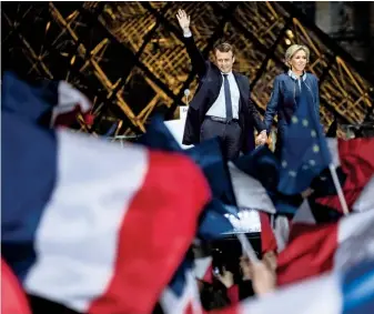  ??  ?? POWER COUPLE: A key part of Macron’s appeal was that he represente­d no traditiona­l party, but that may also hinder his efforts to win a robust majority in the parliament.