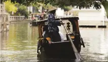  ??  ?? Enjoy a boat ride along Suzhou’s canals (above); Il Bar at the Bulgari Hotel Shanghai (below)