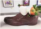  ?? COURTESY OF Q’S CAKES AND SWEETS BOUTIQUE ?? Don’t forget about the men on Valentine’s Day. This chocolate shoe is available at Q’s Cakes and Sweets Boutique.