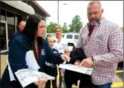  ?? NWA Democrat-Gazette/JASON IVESTER ?? Rebecca Powers and Eric White, both Bentonvill­e school board members, look over neighborho­od maps Friday to pass out literature to Centerton homes to promote a millage increase to voters.