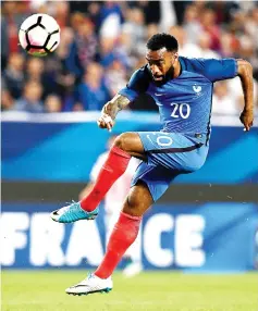 ?? — AFP photo ?? This file photo taken on June 02, 2017 shows France's forward Alexandre Lacazette kicks the ball during the friendly football match France versus Paraguay at the Roazhon Park stadium in Rennes.