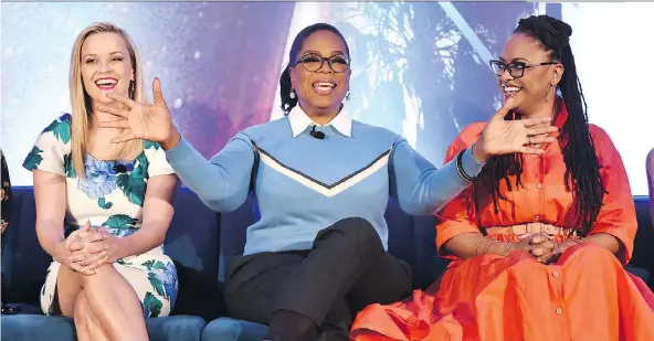  ?? ALBERTO E. RODRIGUEZ/GETTY IMAGES ?? Reese Witherspoo­n, left, Oprah Winfrey and Ava DuVernay discuss their new project, A Wrinkle in Time, based on Madeleine L’Engle’s 1962 novel.