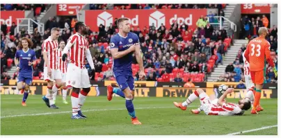  ??  ?? Chelsea’s Gary Cahill celebrates scoring their second goal against Stoke City in the English Premier League on Saturday night. (Reuters)