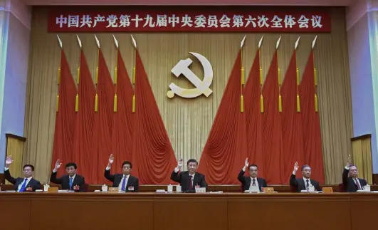  ?? Xie Huanchi, Xinhua via The Associated Press ?? Xi Jinping, center, and other members of the Central Committee attend a Communist Party meeting Thursday in Beijing. Leaders set the stage for Xi to extend his rule next year, praising his role in the country’s rise as an economic and strategic power and approving a political history that gives him status alongside the nation’s most important party figures.