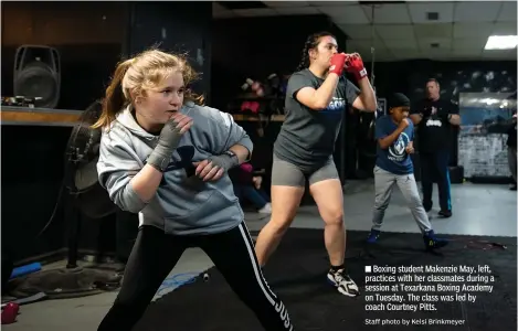  ?? Staff photo by Kelsi Brinkmeyer ?? ■ Boxing student Makenzie May, left, practices with her classmates during a session at Texarkana Boxing Academy on Tuesday. The class was led by coach Courtney Pitts.