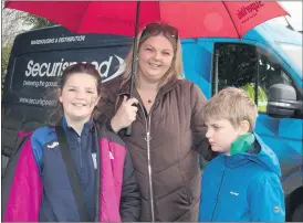  ?? (Photo: Ita West) ?? Amelia, Tina and Patrick Whelan who braved the rain to support the Kilfinane St Patrick’s Day parade.