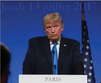  ?? (Photo by Carolyn Kaster, AP) ?? President Donald Trump pauses during a joint news conference with French President Emmanuel Macron at the Elysee Palace in Paris, Thursday, July 13, 2017.