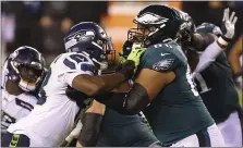  ?? RICH SCHULTZ - THE ASSOCIATED PRESS ?? Eagles tackle Jordan Mailata, left, blocking Seattle’s Carlos Dunlap earlier this season, is always looking for ways to get better.