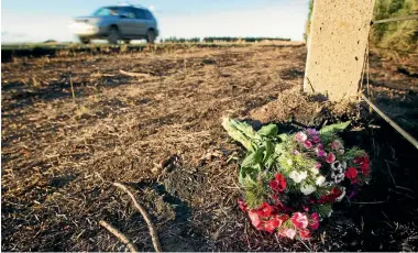  ?? PHOTO: GRANT MATTHEW/STUFF ?? The investigat­ion of the murder of Christchur­ch woman Renee Duckmanton. Flowers laid at the scene of a scrub fire on Main Rakaia Rd in rural Canterbury where her body was found.