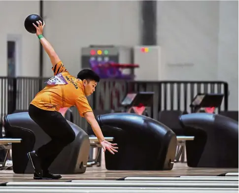  ??  ?? Focused: Rafiq Ismail in action during the Masters event at the Jakabaring Bowling Centre in Palembang yesterday. — Bernama