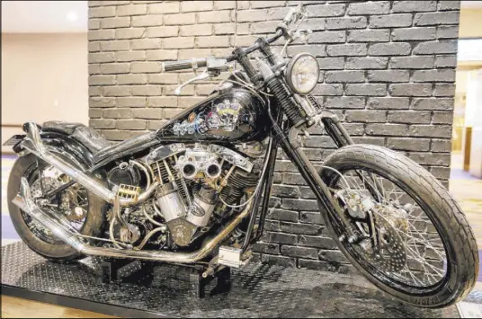  ?? K.M. Cannon Las Vegas Review-Journal ?? MÖtley Crüe bassist Nikki Sixx’s custom Harley-Davidson, on display in the Hard Rock’s memorabili­a exhibit.