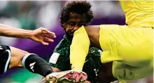  ?? AFP ?? Saudi footballer Yasser Al-Shahrani collided with goalkeeper Mohammed Al-Owais at the Kingdom’s historic match with Argentina.