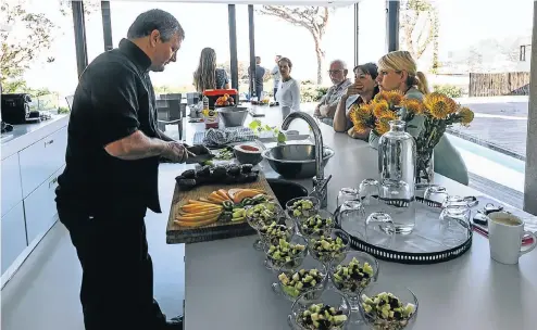  ?? Picture: Supplied ?? Executive chef Justin van Straaten, who is part of the Seasoned team, prepares a feast at a private home.