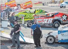  ??  ?? Drivers and race crews finally get some good weather and track conditions at Merrittvil­le Speedway in Thorold.