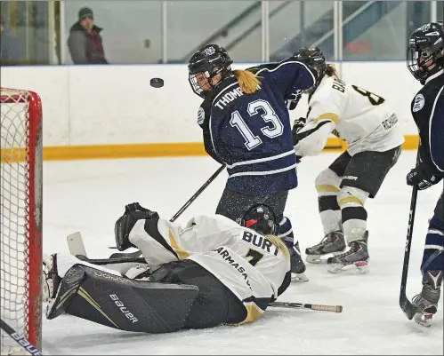  ?? STEVEN MAH/SOUTHWEST BOOSTER ?? Wildcats’ forward Samantha Thompson (#13) was eyeing up a rebound in the crease of Weyburn’s Chloe Burt during a 6-1 win on Saturday.