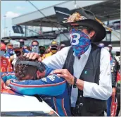  ?? AP-John Bazemore ?? NASCAR driver Bubba Wallace is consoled by team owner Richard Petty, right, prior to the start of the NASCAR Cup Series at the Talladega Superspeed­way in Talladega, Ala.