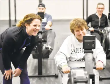  ?? Peter Hvizdak / Hearst Connecticu­t Media ?? Co-manager and coach Michelle Menard of Hammonasse­t CrossFit of Madison watches Andrea, of Westbrook, a Vista Life Innovation­s student, workout.