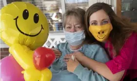  ?? Pam Panchak/Post-Gazette ?? Michelle Tibble, owner of Awesome Balloon Creations, right, brings along a balloon friend during a visit with her aunt Judy Metrovich, a resident of ManorCare Health Services in Peters.