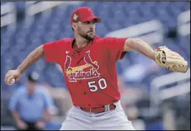  ?? AP PHOTO/ SUE OGROCKI ?? St. Louis Cardinals starting pitcher Adam Wainwright (50) pitches in the first inning of a spring training baseball game against the Houston Astros, on March 23 in West Palm Beach, Fla.