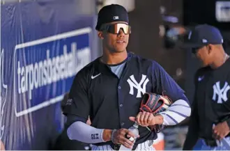  ?? AP PHOTO/CHARLIE NEIBERGALL ?? New York Yankees right fielder Juan Soto stands in the dugout before a spring training game against the Boston Red Sox on March 13.