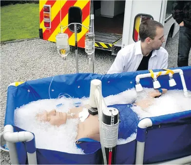  ?? CRYONICS UK ?? Volunteers with Cryonics UK train with a dummy on the process in which a person is “frozen in time” after death.