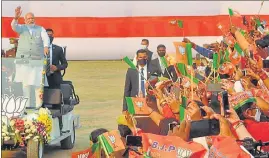  ?? HT PHOTO ?? Prime Minister Narendra Modi waves towards supporters during ‘Booth Vijay Sammelan’ for the ongoing Uttar Pradesh assembly elections, in Varanasi on Sunday