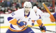  ?? Julio Cortez / Associated Press ?? Islanders center John Tavares skates against the Devils on March 31.