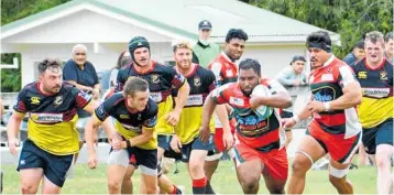  ?? Photos / Arthur Uden ?? O¯ haupo¯ halfback Scott Thomas looks to dive at a Melville B player.