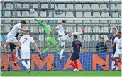  ?? (AFP) ?? England's John Stones (centre) vies with Croatia's goalkeeper Dominik Livakovic during their Nations League match in Rijeka, on Friday