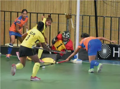  ??  ?? Action from the Pool A match between AIU and Uttar Pradesh Hockey in the five-a-side senior national championsh­ip in Balewadi, Pune, on Wednesday. AIU won 12-2.