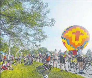  ?? Zach Boyden-holmes
The Des Moines Register ?? Riders pack the road Wednesday on the way into Slater, Iowa, during the RAGBRAI cycling event across Iowa. Events like RAGBRAI are helping small towns flourish.