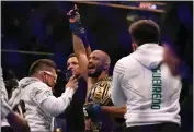  ?? ?? Deiveson Figueiredo celebrates after defeating Brandon Moreno via unanimous decision during UFC 270.