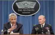  ?? AP Photo ?? In this May 17 file photo, Defense Secretary Chuck Hagel, left, and Chairman of the Joint Chiefs of Staff, Gen. Martin Dempsey take turns talking to media during a news conference at the Pentagon.