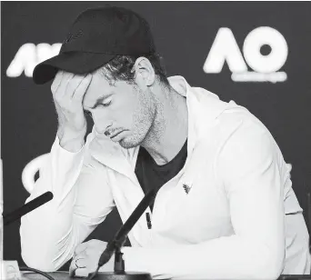  ?? KIN CHEUNG THE ASSOCIATED PRESS ?? Britain’s Andy Murray reacts during a news conference following his first-round loss to Spain’s Roberto Bautista Agut at the Australian Open tennis tournament Monday.