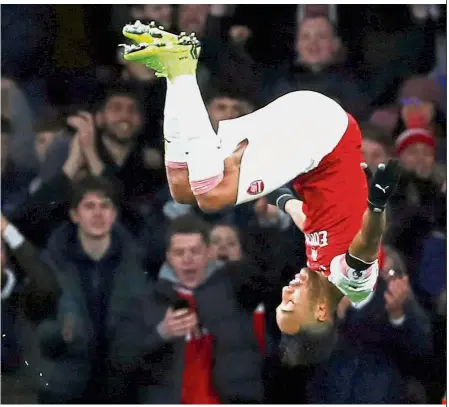  ?? — Reuters ?? Over the moon: Arsenal’s Pierre-Emerick Aubameyang celebratin­g after scoring their fourth goal against Fulham in the Premier League match on Tuesday.