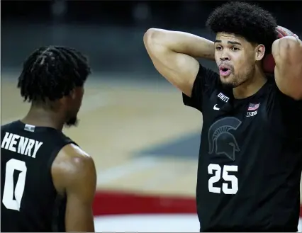  ?? JULIO CORTEZ PHOTOS — THE ASSOCIATED PRESS ?? Michigan State’s Malik Hall, right, reacts after being called for a foul as teammate Aaron Henry looks on during Sunday’s loss to Maryland.