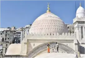  ??  ?? Workers restore a part of the roof of the Ketchaoua mosque in the famed UNESCO-listed Casbah district of Algiers as they complete the final stages of its renovation. — AFP photos