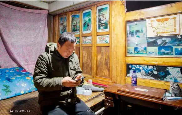  ?? ?? December 7, 2021: Zhang Kai, who posts on the account name “Classmate Zhang,” edits a video at night. The man from Yingkou City in northeaste­rn China’s Liaoning Province became an internet sensation by posting his daily life on short-video platform Douyin, the Chinese version of Tiktok. VCG