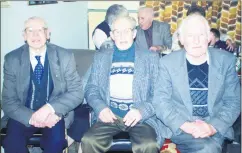  ?? ?? L-r: Dinny, Con and Paddy O’Driscoll, who had front row seats for the Jim Hogan/Finbarr O’Connell rings match held in Grindel’s Bar, Ballyhooly in 2001. The match proved to be a complete sell out, with victory going to Finbarr O’Connell.