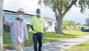  ?? PHELAN M. EBENHACK FOR THE CENTER FOR PUBLIC INTEGRITY ?? Sgt. Mario Victorez Wilcox, right, and City Commission­er Reggie Sessions stand in the Lincoln Park neighborho­od Nov. 20 in Fort Pierce.