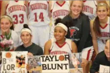  ?? COURTESY OF THE PENNINGTON SCHOOL ?? Taylor Blunt celebrates with her Pennington teammates after scoring her 1,000th career points in Monday’s game against Lawrencevi­lle.