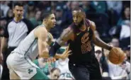  ?? THE ASSOCIATED PRESS ?? Cleveland Cavaliers’ LeBron James (23) drives past Boston Celtics’ Jayson Tatum during the second quarter of an NBA basketball game in Boston Sunday.