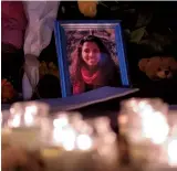  ??  ?? The co-workers of shooting victim Ansi Alibava created a shrine to honour her memory
