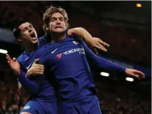  ??  ?? Chelsea’s goalscorer­s Alvaro Morata and Marcos Alonso celebrate after the latter’s strike in their victory against Brighton