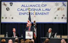  ??  ?? In this March 7, file photo, U.S. Attorney General Jeff Sessions addresses the California Peace Officers’ Associatio­n at the 26th annual Law Enforcemen­t Legislativ­e Day in Sacramento. The Trump administra­tion is suing California over a law that aims to...